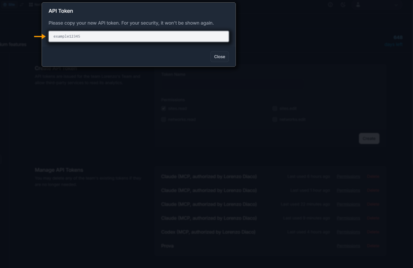 The API Token dialog showing a freshly created token, with a warning that it won't be shown again.
